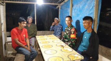 Hujan Tak Menyurutkan Personil Koramil 04/Kubu Laksanakan  Kegiatan Patroli Kamtibmas.